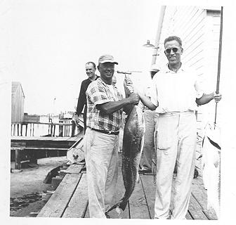Thurston Gaskill displaying the catch of the day on Ocracoke Island, North Carolina