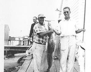 Thurston Gaskill displaying the catch of the day on Ocracoke Island, North Carolina